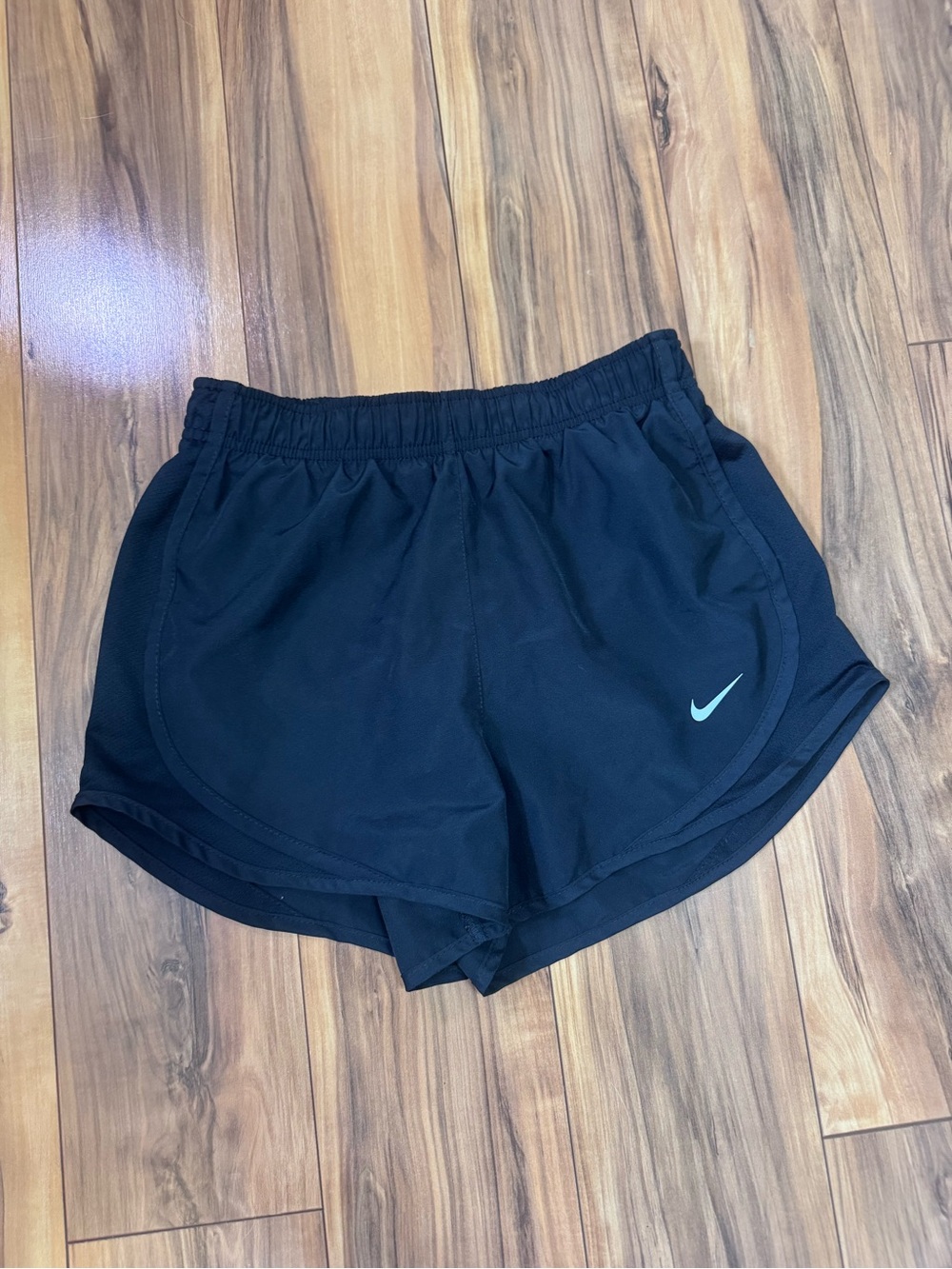 Nike Women's Black Athletic Shorts with Light Blue Swoosh
